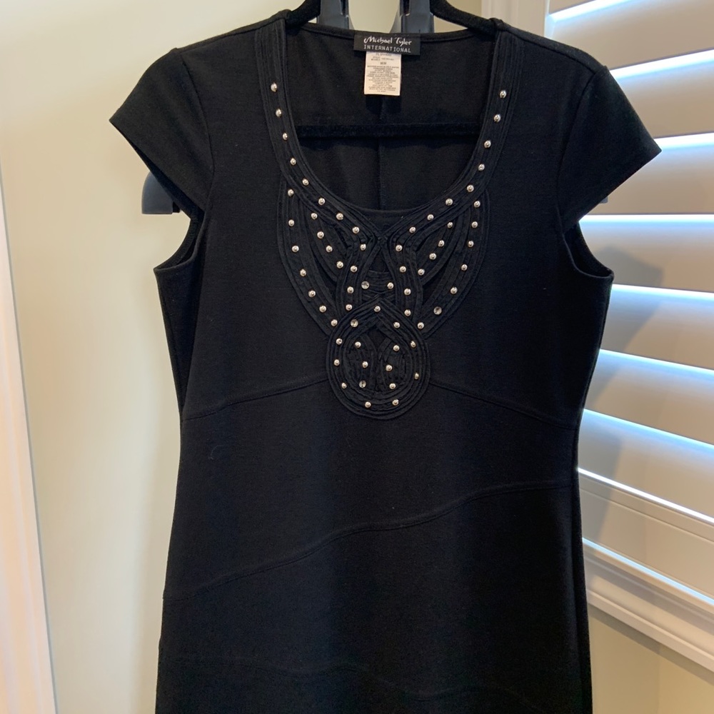 Black cap sleeve above knee dress studded front. Worn once.Poly Rayon Spandex.